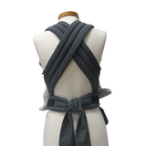 Babycarrier Graphit Slim with adjustable straps and waist belt on mannequin.
