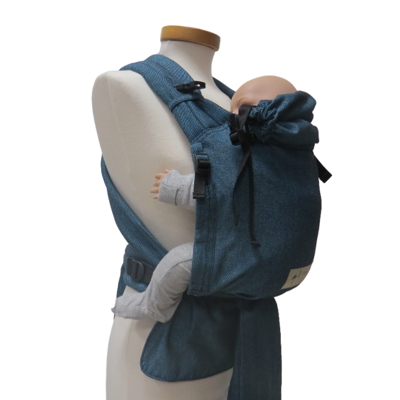 Turquoise baby carrier with adjustable straps and ergonomic design for optimal comfort.