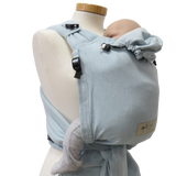 Babycarrier Aqua in ocean blue with adjustable straps for newborns up to 15 kg.