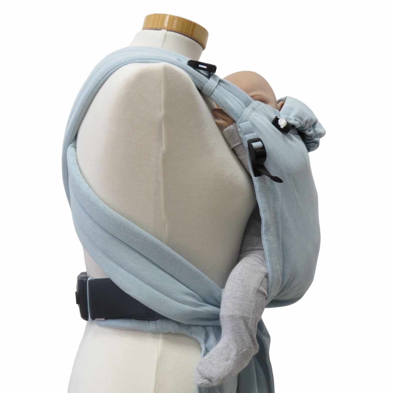 Babycarrier Aqua in ocean blue with padded straps and three-point safety buckle, suitable from birth to 15 kg.