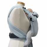 Babycarrier Aqua in ocean blue with padded straps and three-point safety buckle, suitable from birth to 15 kg.