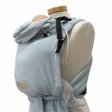 Babycarrier Aqua in ocean blue on mannequin, adjustable straps, and padded waistband.
