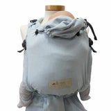Ocean blue Babycarrier Aqua with padded straps and waistband; adjustable seat for newborns to 15 kg; includes headrest and three-point safety buckle.