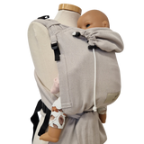 Optimal adjustable Mondstein baby carrier with padded straps and waist belt.