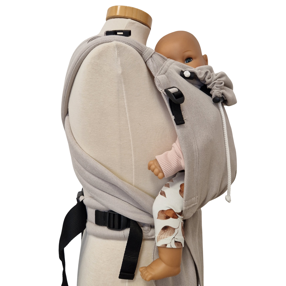 Babycarrier Mondstein in gray, adjustable half-buckle design, worn on mannequin with doll.