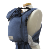 Babycarrier with jeans design and adjustable straps on mannequin.