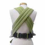 Green adjustable half-buckle baby carrier with web pattern, padded straps, and three-point safety buckle.