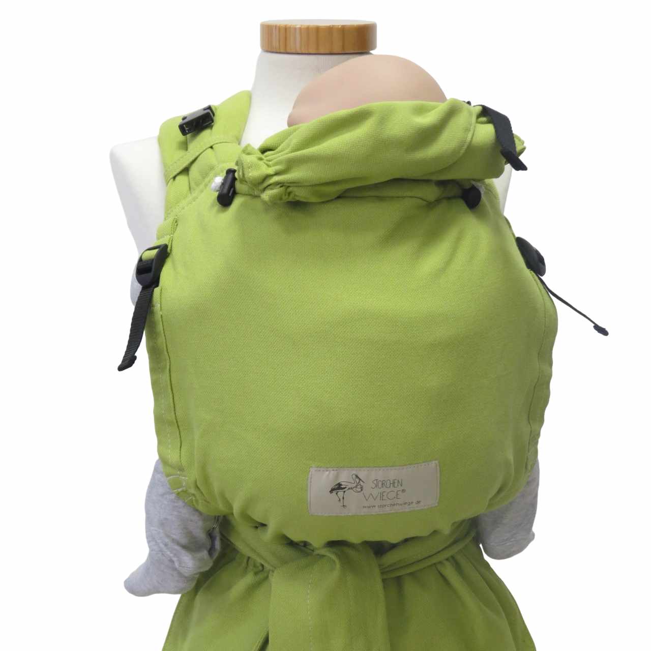 Maigrün baby carrier with adjustable straps and safety buckle.