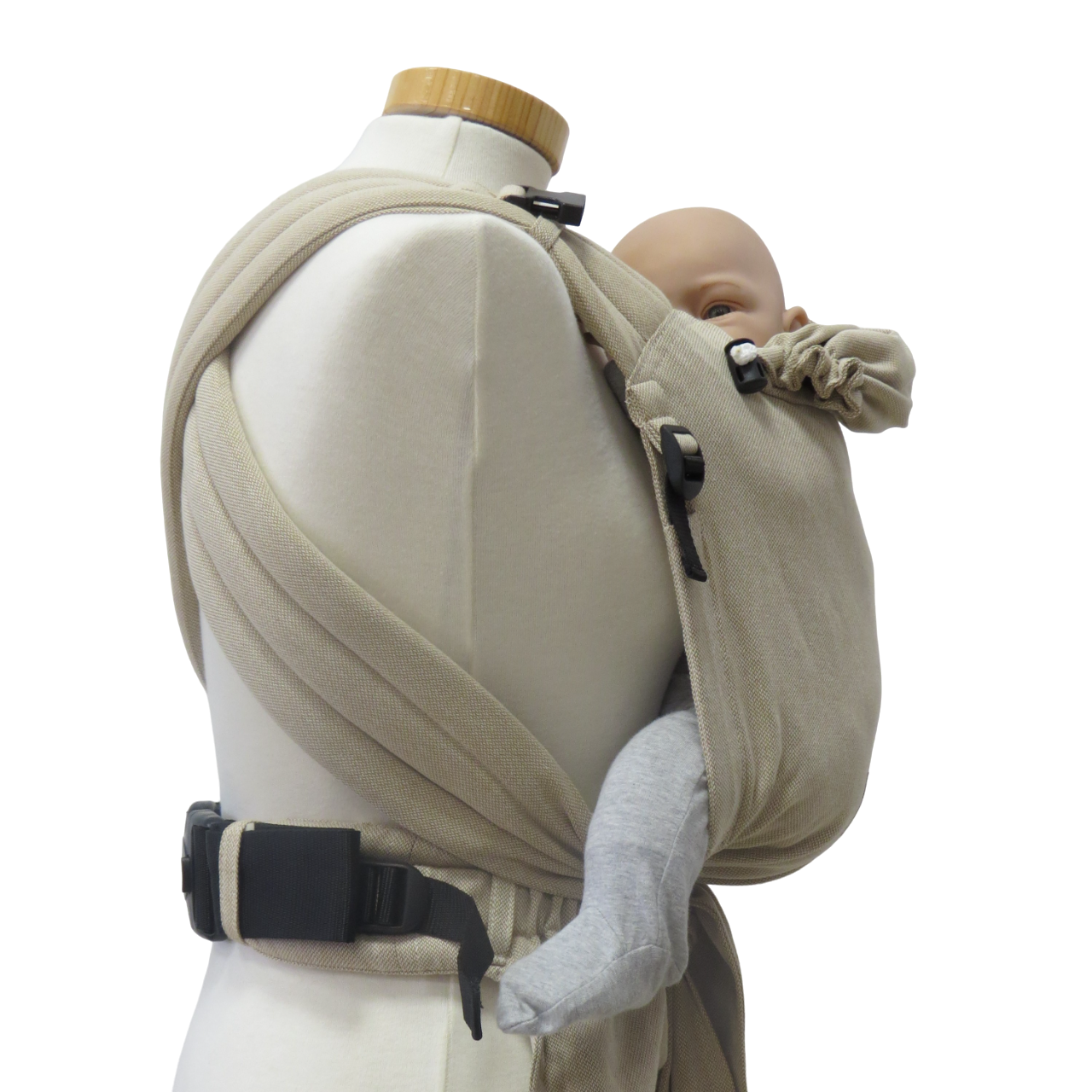 Babytrage Natur Half-Buckle in beige with newborn, adjustable cushioned straps.
