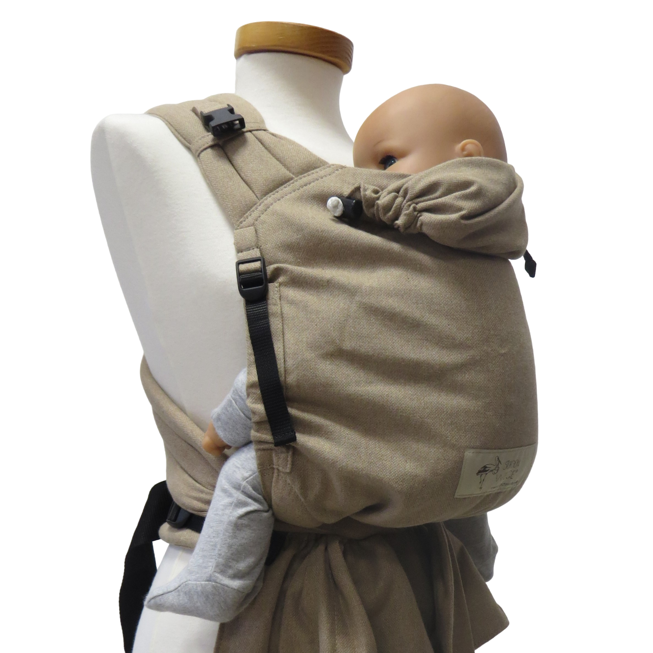 Babycarrier Sand in use, showing adjustable straps and ergonomic design for newborns to toddlers.