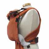 Babycarrier Terra with adjustable straps and ergonomic design in orange.