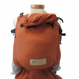 BabyCarrier Terra in orange, ergonomic half-buckle design for newborn to 15 kg, cotton fabric.