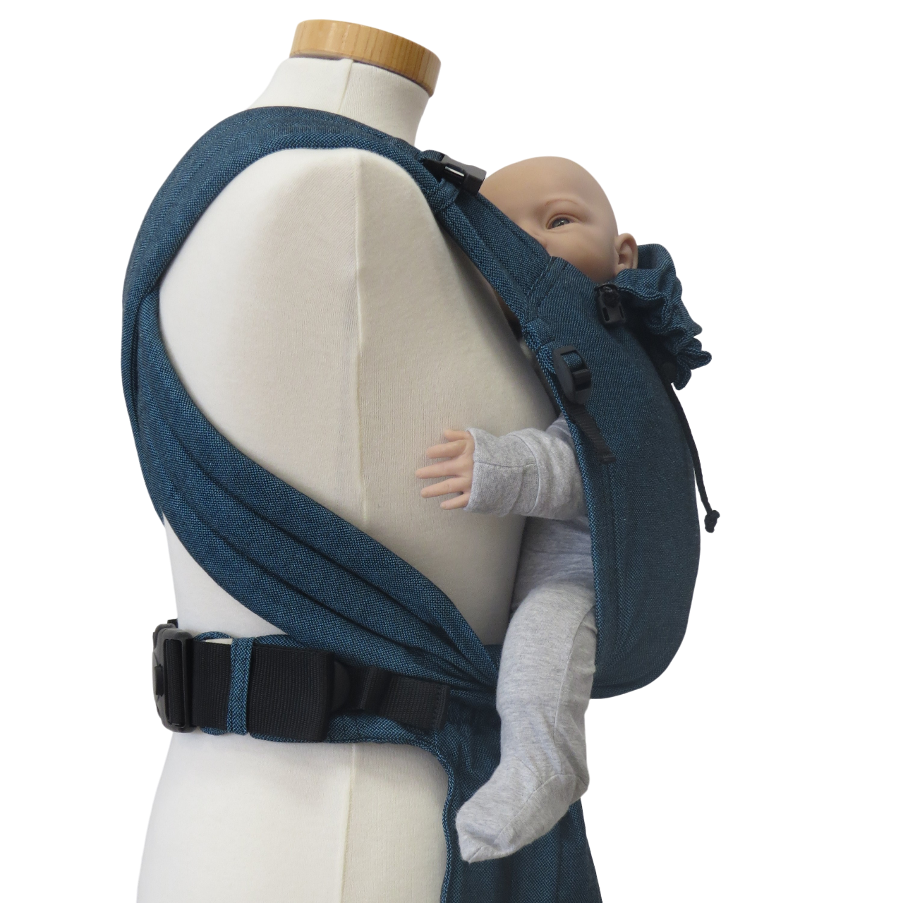 Babycarrier in turquoise with padded straps and waist belt, suitable for front and back carrying.