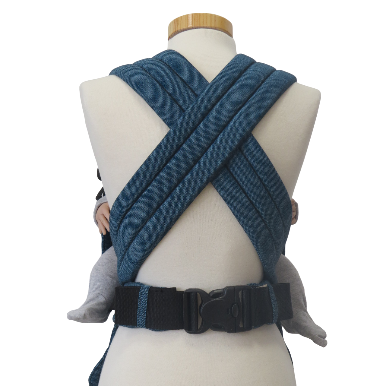 Babycarrier Türkis with adjustable straps and safety buckle, suitable for newborn to 15 kg.