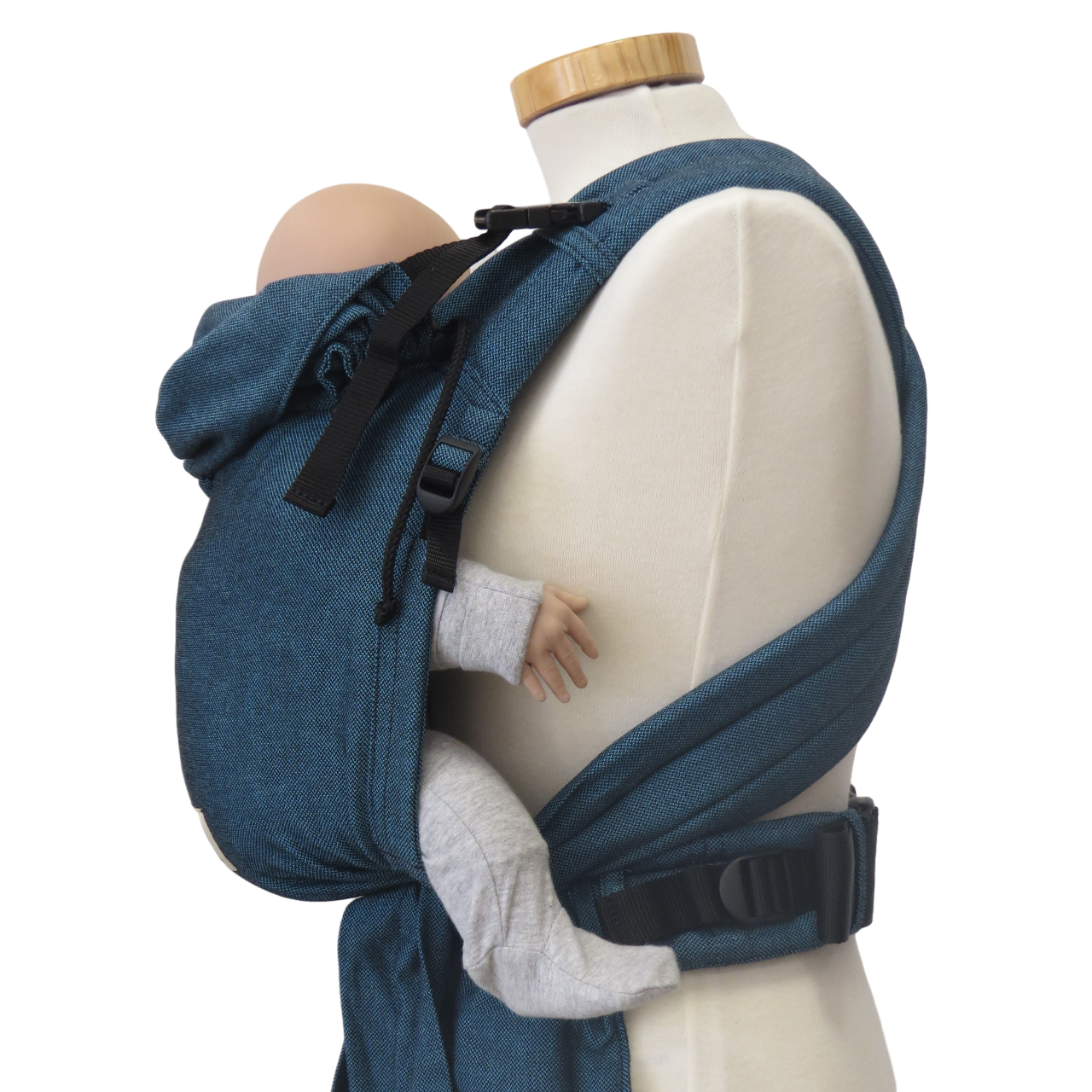 Babycarrier Türkis with adjustable straps and padded waistband for newborns to 15 kg.