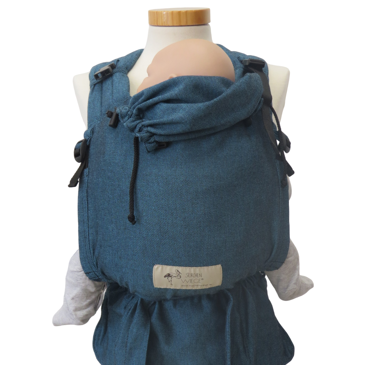 Babycarrier Türkis with adjustable features and padded straps, suitable from birth to 15 kg.
