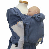 Wrapbabycarrier in jeans-optic with broad shoulder straps and waist belt.
