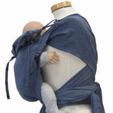 Optimal adjustable baby wrap carrier with broad shoulder straps and jeans look.