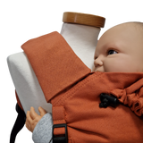 Babycarrier Gurtschoner protecting shoulder straps on baby carrier with mannequin.