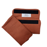 Babycarrier Gurtschoner shoulder strap protectors in orange fabric with Velcro fastening.