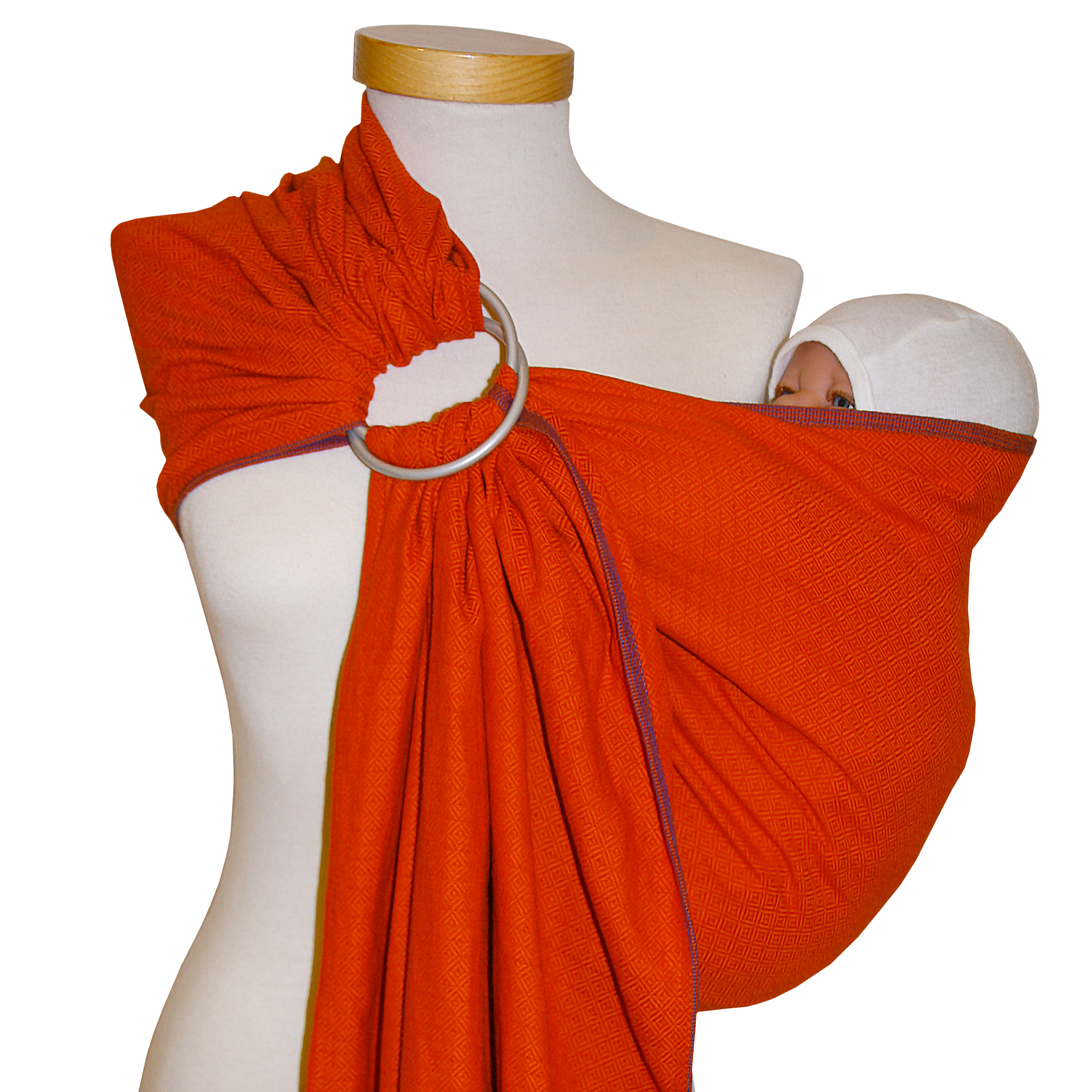 Ringsling Leo Orange with web pattern holding a baby, ideal for short distances and suitable for various carriers.