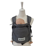 Valeno Graphit baby carrier in gray with padded straps and adjustable support for newborns.