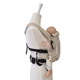 Valeno Mondstein baby carrier with full buckle, padded straps, adjustable seat, integrated head support, beige cotton fabric.