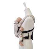 Valeno Mondstein baby carrier with full buckle, padded straps, adjustable seating, and integrated head support in beige cotton
