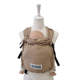 Valeno Sand baby carrier in sand color with full buckle, padded straps, adjustable seat, integrated head support, and front and back carrying options