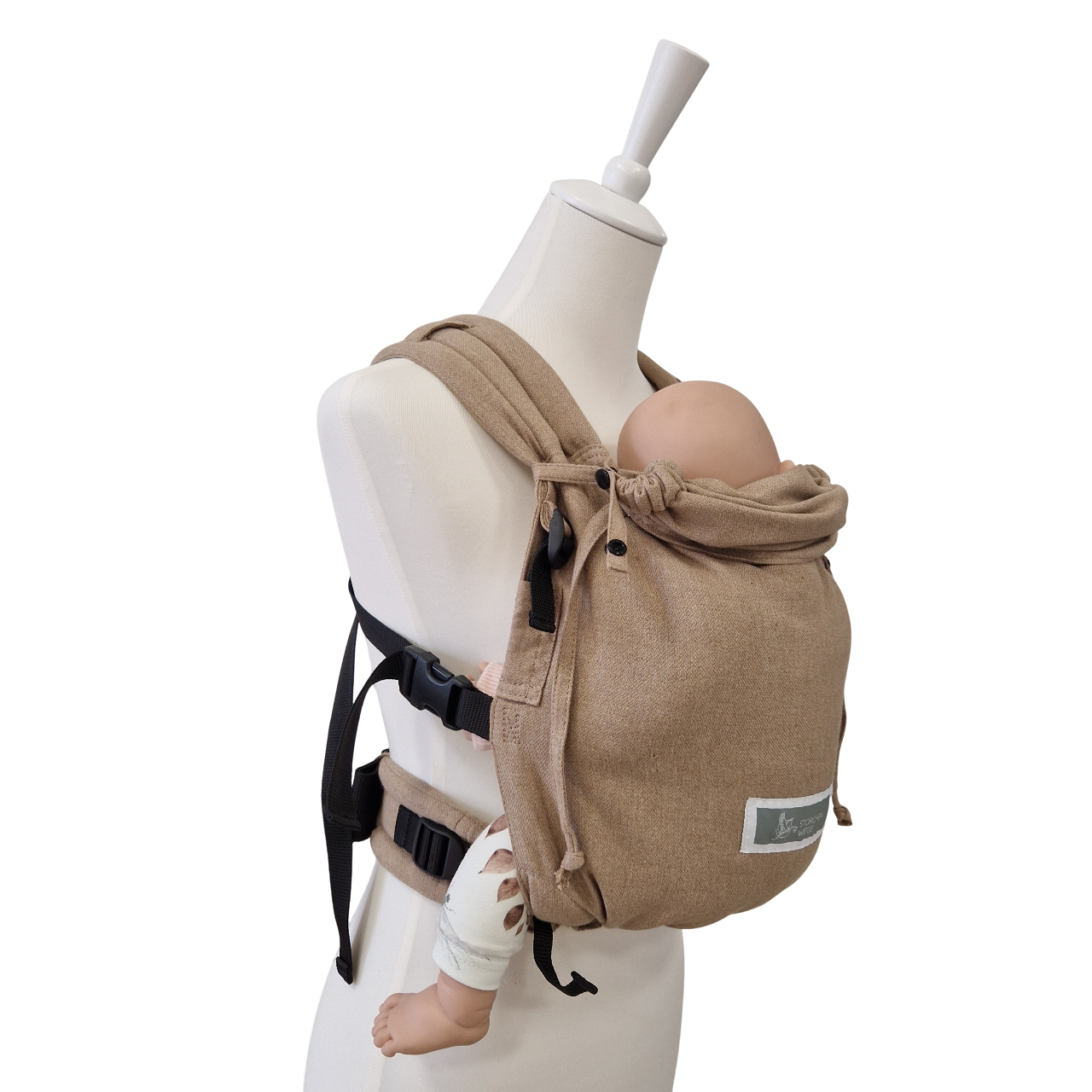 Valeno Sand baby carrier in sand color with full buckles and padded straps on mannequin