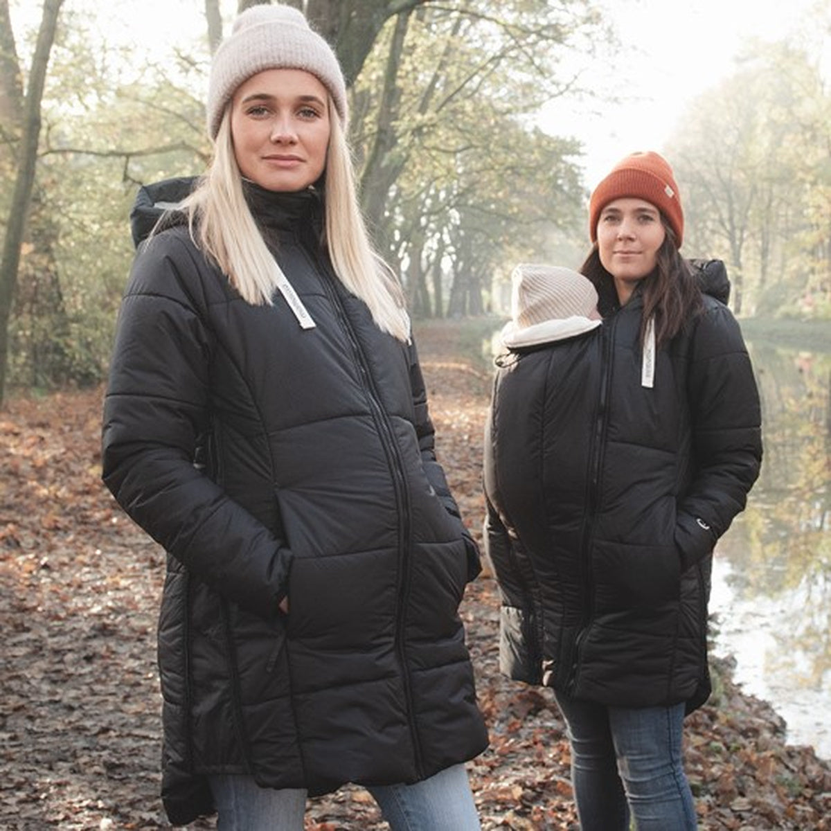 Mamalila Winter-Tragemantel black padded babywearing coat with hood and zippered pockets for cold weather