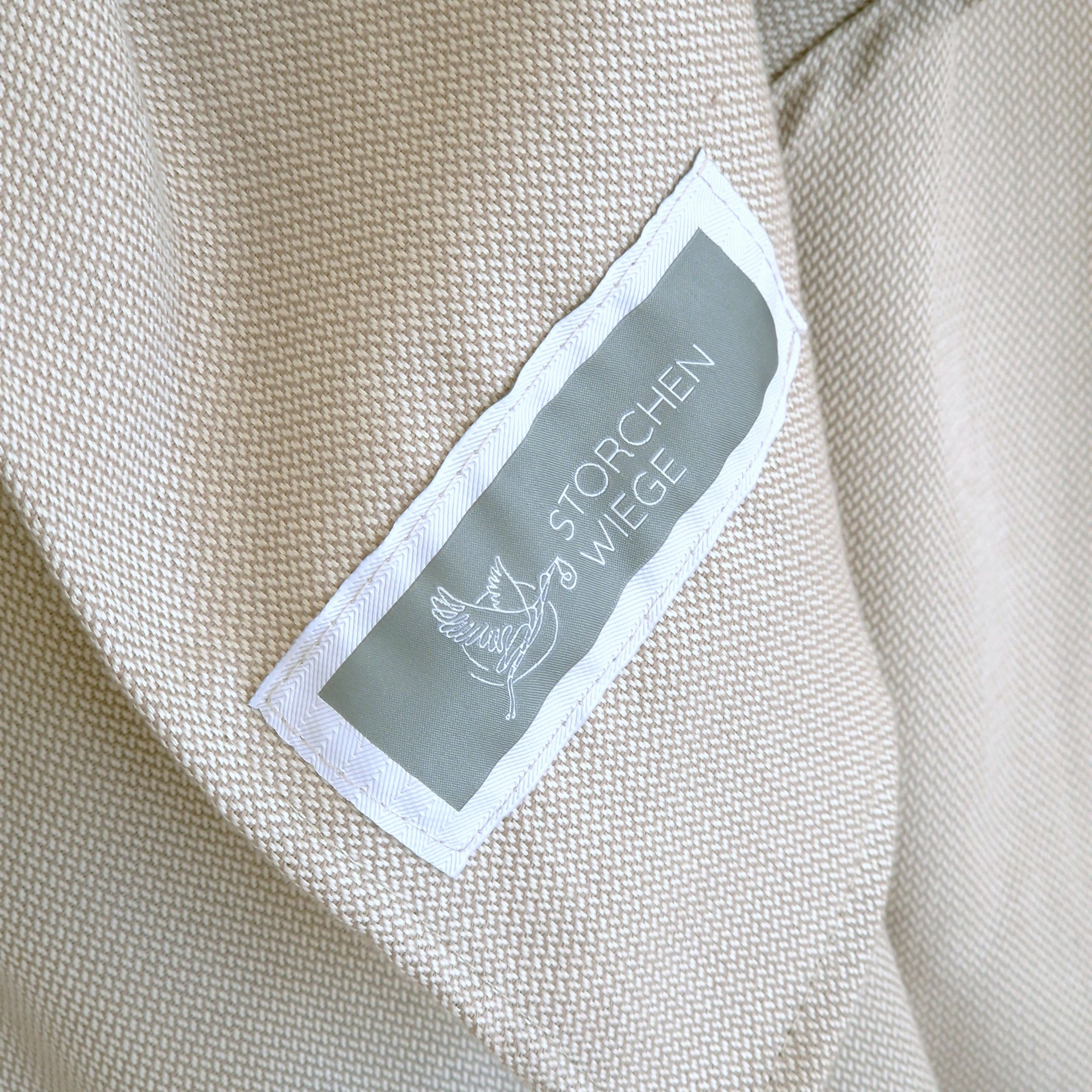 Ringsling Mondstein Tragetuch aus 100% Baumwolle mit zartem Webmuster und Labeldetail