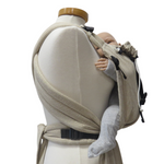Babycarrier Natur Slim with adjustable half-buckle design in natural color, featuring padded straps and waistband.