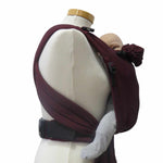 Optimal adjustable Half-Buckle Babycarrier in Bordeaux, 100% cotton, suitable for newborns from 3.5 kg to 15 kg, featuring padded straps, safety buckles, and support for healthy positioning.