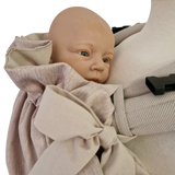 Storchenwiege Tragecover Natur covering baby for warmth and protection.