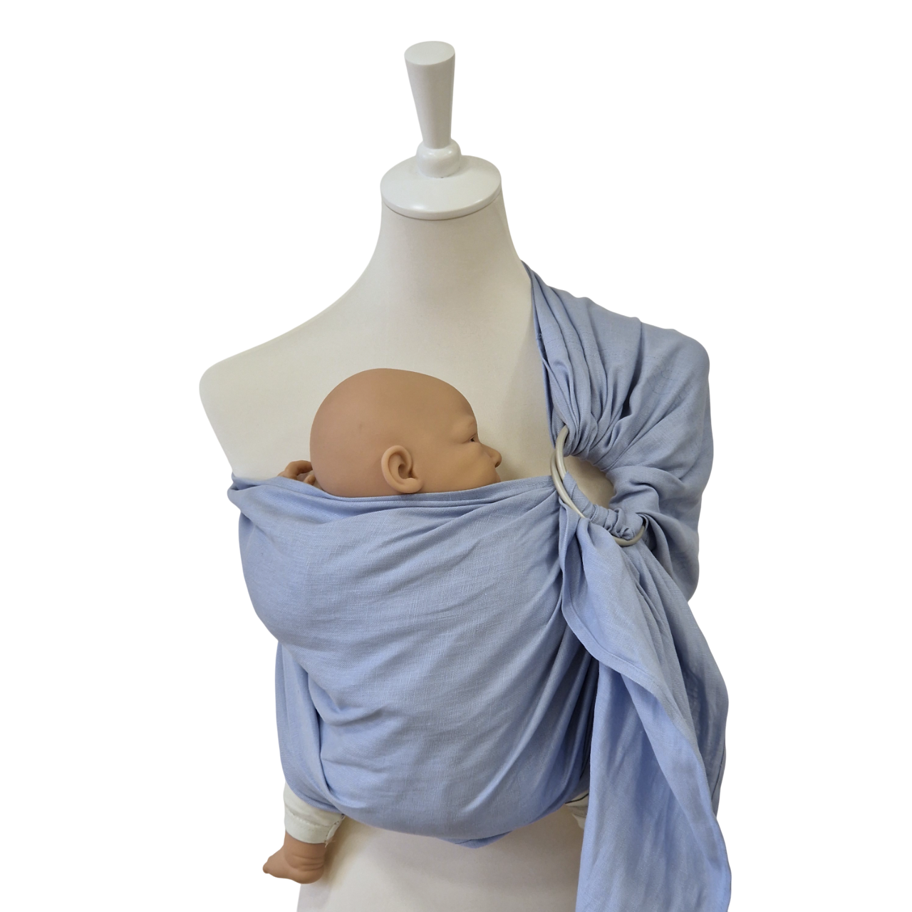 Leinen-RingSling KRISTALLKLAR baby carrier in light blue linen on mannequin with doll baby inside