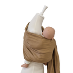 Beige Leinen-RingSling baby carrier wrapped around mannequin holding a baby doll securely and comfortably