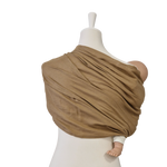 Beige Leinen-RingSling baby carrier wrapped on mannequin holding a doll, breathable linen fabric.