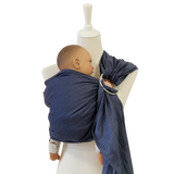 Baby in indigo Leinen-RingSling carrier on white mannequin