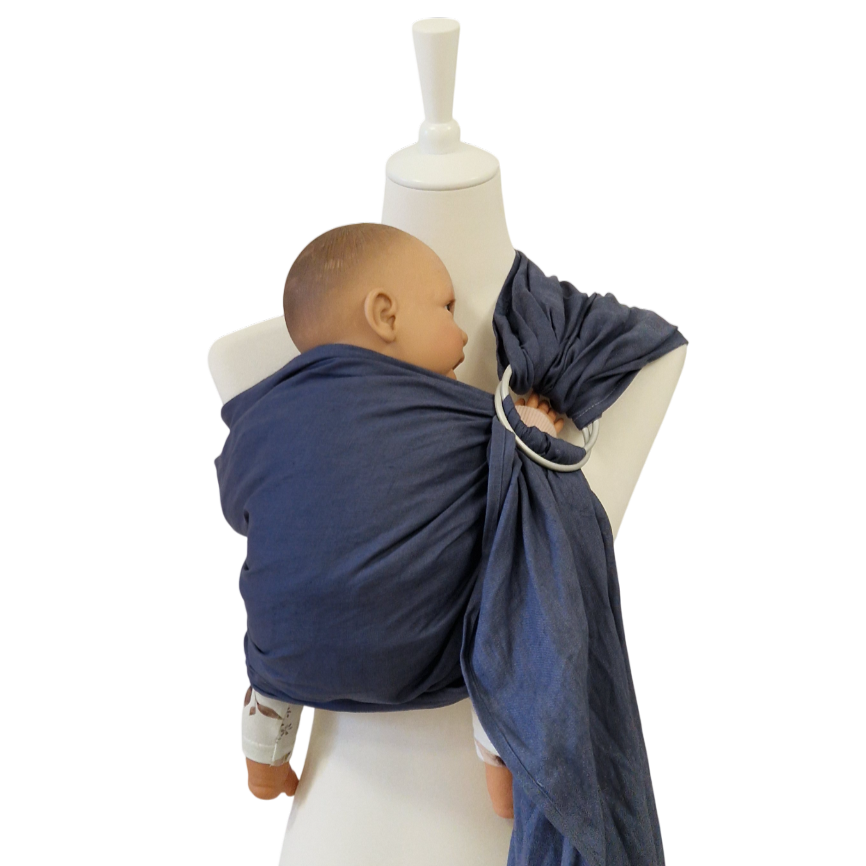 Baby in indigo Leinen-RingSling carrier on white mannequin