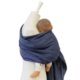 baby carrier Leinen-RingSling INDIGO in indigo blue linen fabric on mannequin with baby doll
