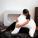 Ergonomic MeroWings Flügelkissen in kunstfell with flexible design, perfect for lounging and reading.