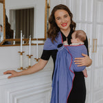 Ringsling Leo Flieder with subtle weave pattern, worn by woman carrying baby.