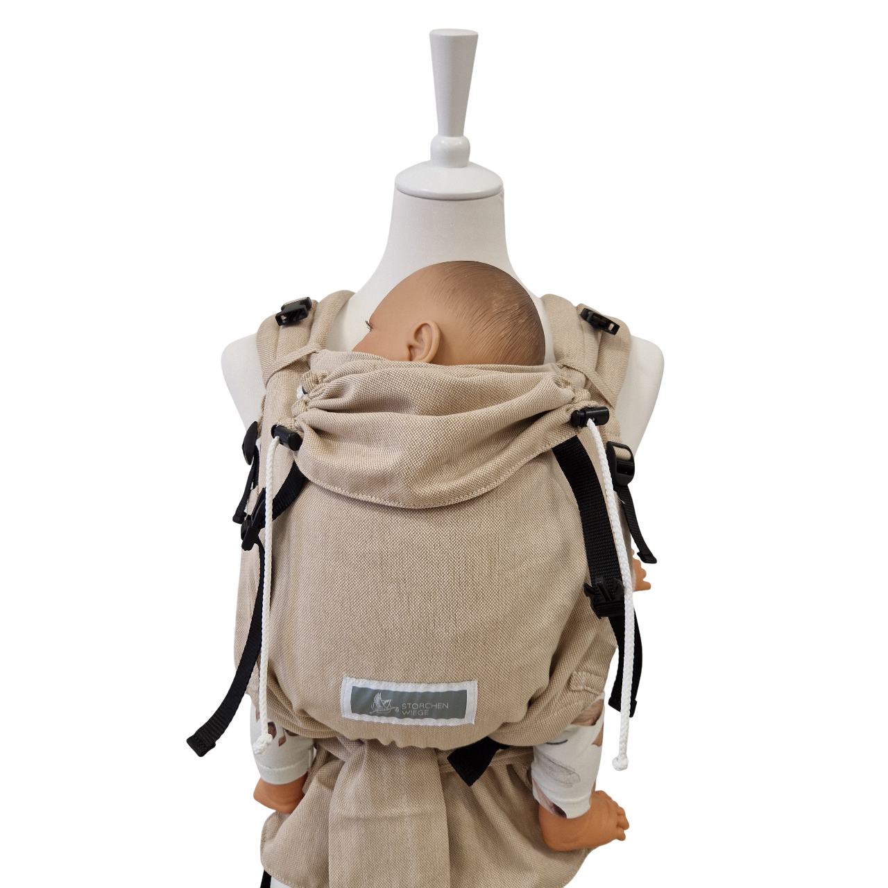 Beige Babycarrier Natur aus Baumwolle mit gepolsterten Trägern und Brustgurt für Neugeborene und Kleinkinder.