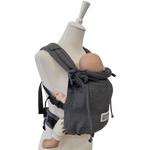 Valeno Graphit baby carrier in graphite color with padded straps and adjustable waist and shoulder belts for newborns to 15 kg.