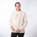 Woman wearing cream Mamalila Fleece Tragejacke babywearing jacket with breathable micro-sherpa fleece and adjustable neck protection