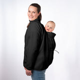 Woman wearing black Mamalila Fleece Tragejacke carrying baby on her back in breathable micro-sherpa fleece babywearing jacket